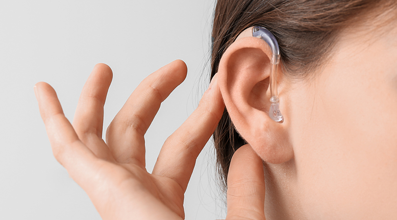 Close up photo of ear showing hearing aid
