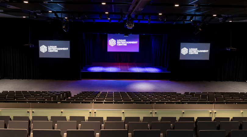 LEC stage view from balcony with three screens and LEC logo on screens