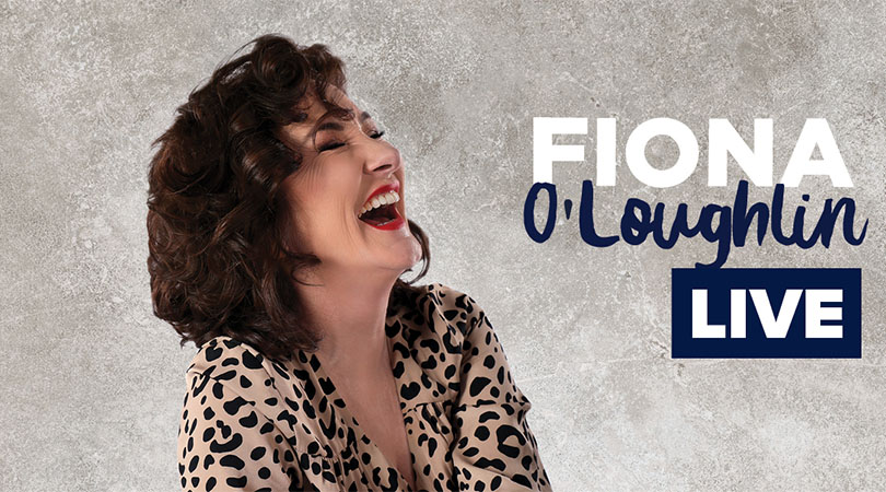 head shot of Fiona O'Loughlin laughing with eyes closed wearing leopard print shirt and red lipstick. Fiona O'Loughlin Live.