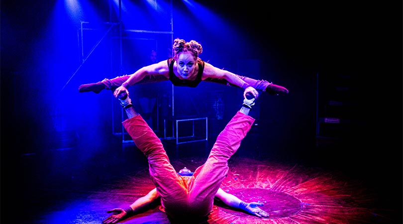 two acrobats on stage