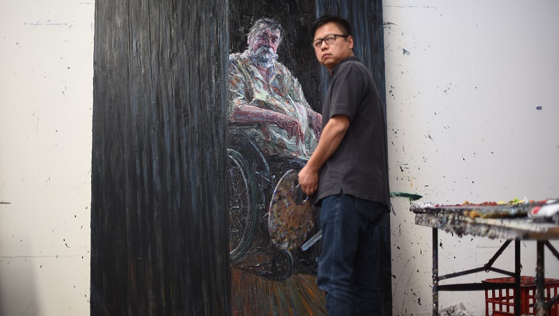 Artist Jun Chen in his Woodridge studio