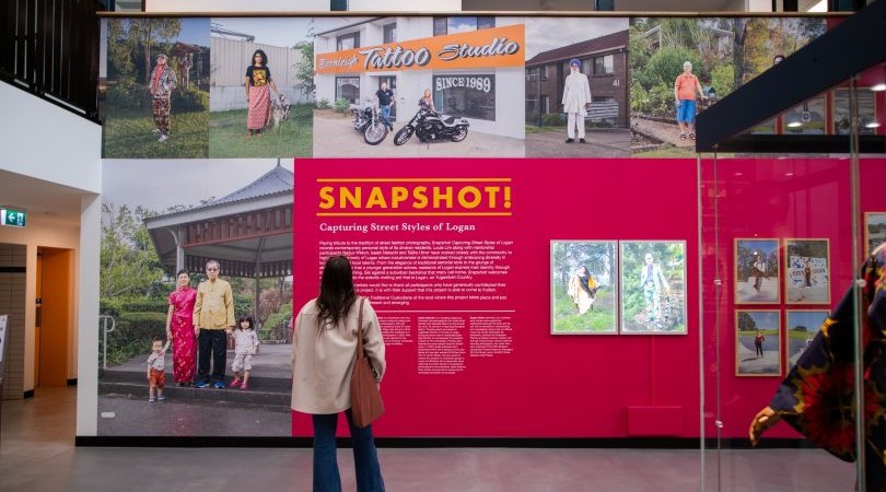 Lady looking at Snapshot! exhibition